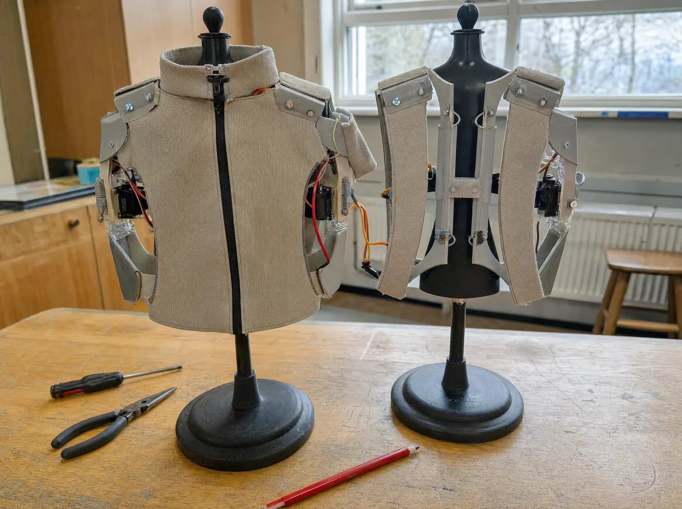 Aditya, with FABRIX. One convertible garment shown in two configurations on twin stands