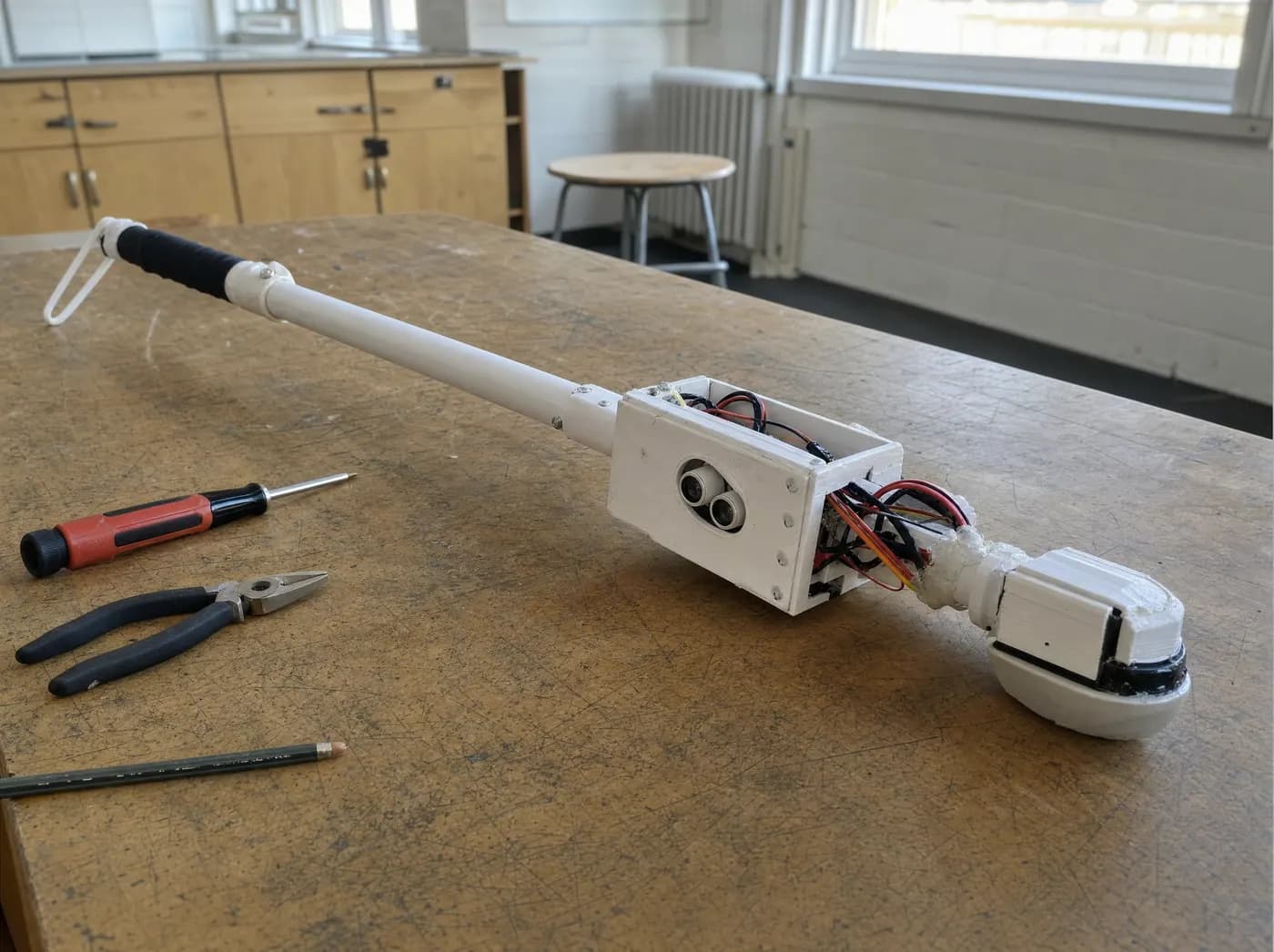 Aisha, with LUMINO. A white smart mobility cane with a sensor pod and haptic grip