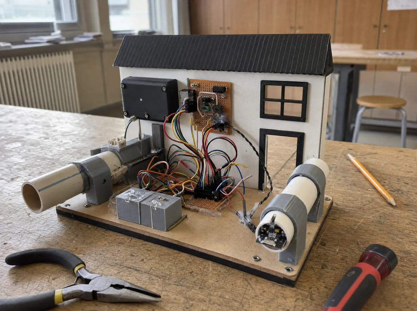 Vedant, with NexaTech. A smart home hub with clip-on water and power sensors on a demo board