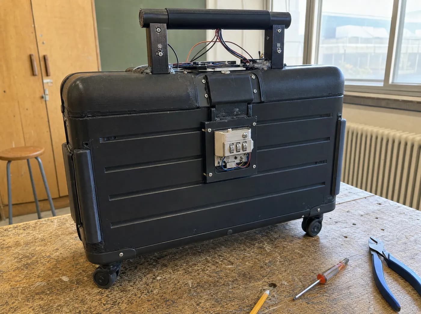 Arnav, with Smart case. A carry-on suitcase with a glowing weighing handle and lock module